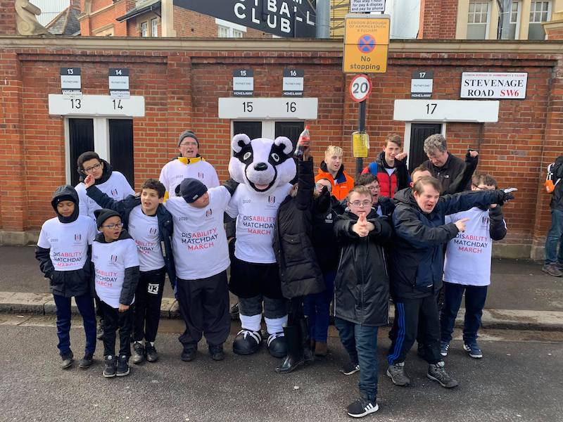 image of the matchday march 2020. Feature participants outside Craven Cottage and FFC mascot Billy the Badger