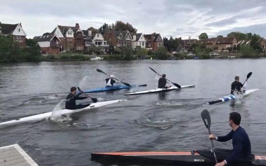 Four kayakers paddling on the Thames by Royal Canoe Club on Trowlock Island in Teddington.