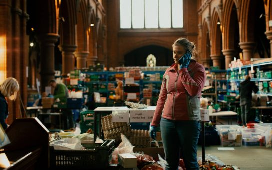 woman at food bank on phone