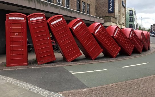 out of order red phone boxes sculpture in Kingston