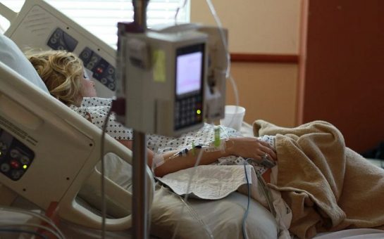 Pregnant woman in hospital bed