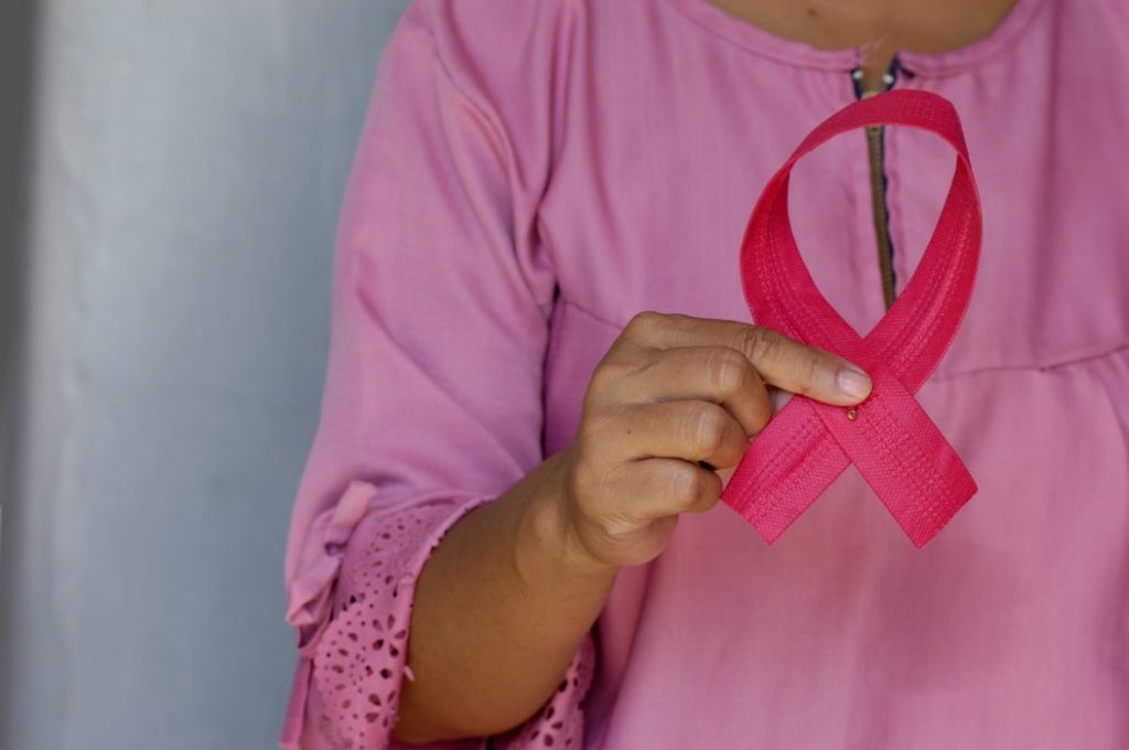 A pink ribbon is used as a symbol for breast cancer awareness.