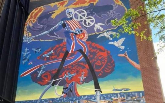 Mural depicting a skeleton walking over the city of London
