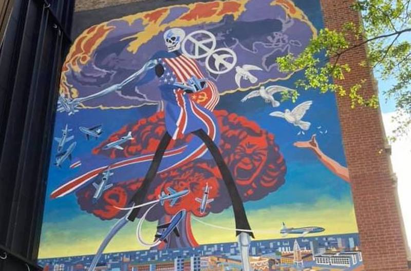 Mural depicting a skeleton walking over the city of London