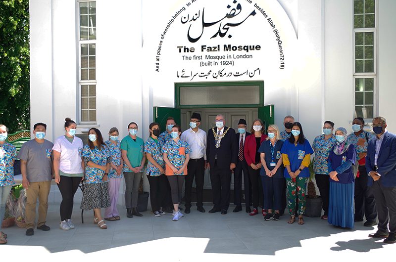 Mayor and MP posing with NHS volunteers