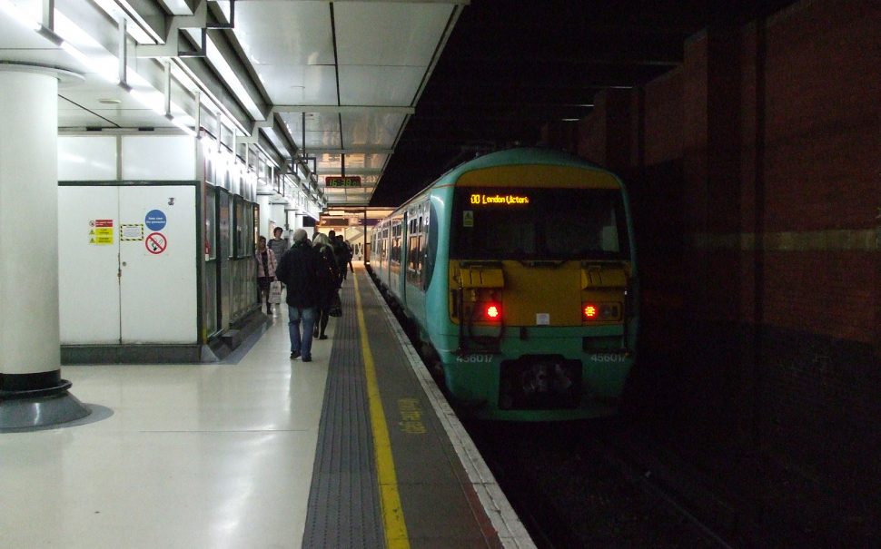 train on a shadowy platform at London Victoria
