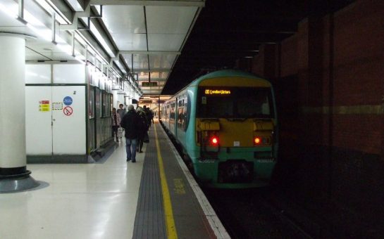 train on a shadowy platform at London Victoria