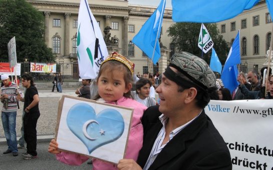 young girla nd her father protesting in Berlin.