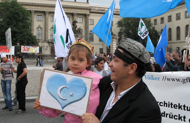 young girla nd her father protesting in Berlin.