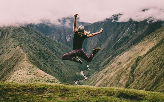 Man jumping in the air against a backdrop of nature