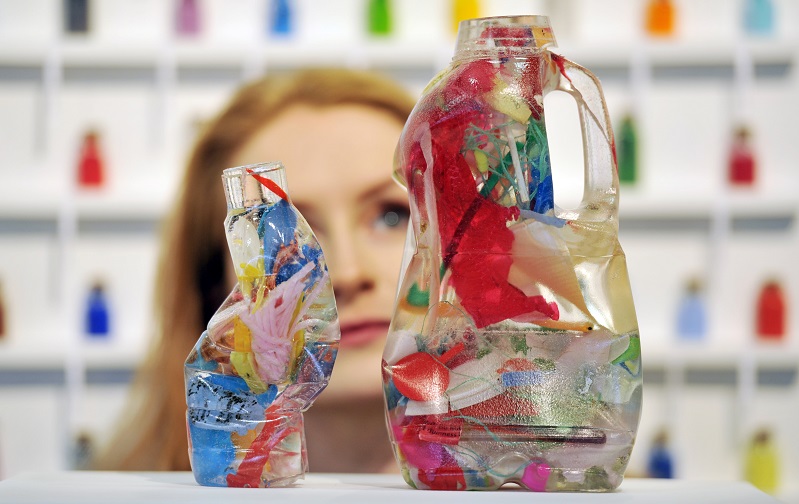 Exhibitor takes in Sea Belly by recent graduate Aoife Scott for sale at the Affordable Art Fair.