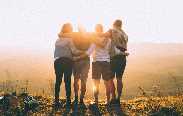 Group of friends with their arms around each other