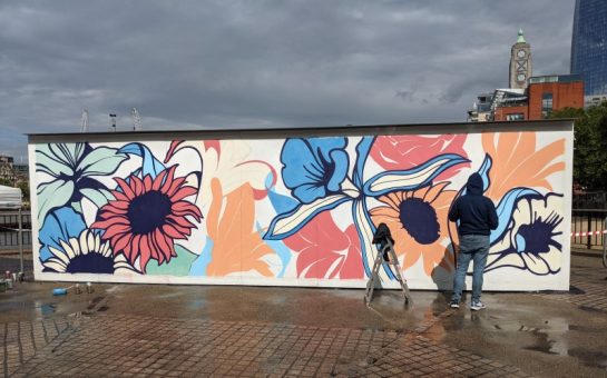 Artist Nerone painting his carbon-absorbing mural for Lindeman's on the South Bank