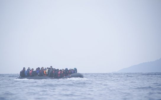 Refugees on a boat crossing the Mediterranean sea