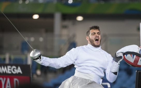 dimitri coutya celebrating his bronze medal