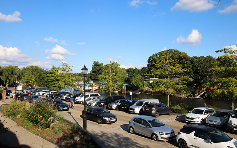 Car park on Twickenham riverside, from Sunshine cafe, overlooking river.