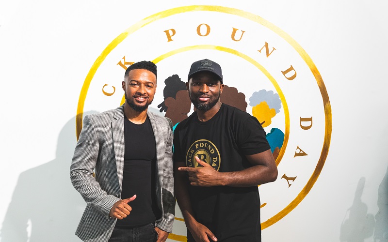 David Cole, owner of Mythical Canvas business, with Swiss, Black Pound Day founder at the Black Pound Day pop-up shop in Westfield London White City