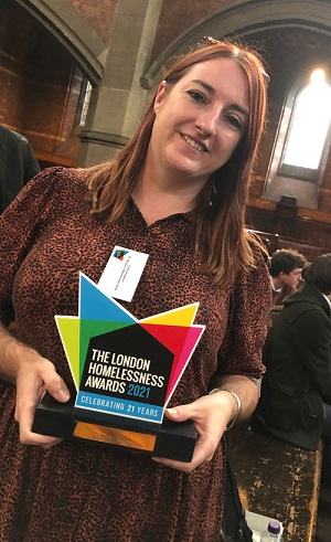 Claire Hopkins of the Westminster Street Outreach services holds up the London Homelessness Award