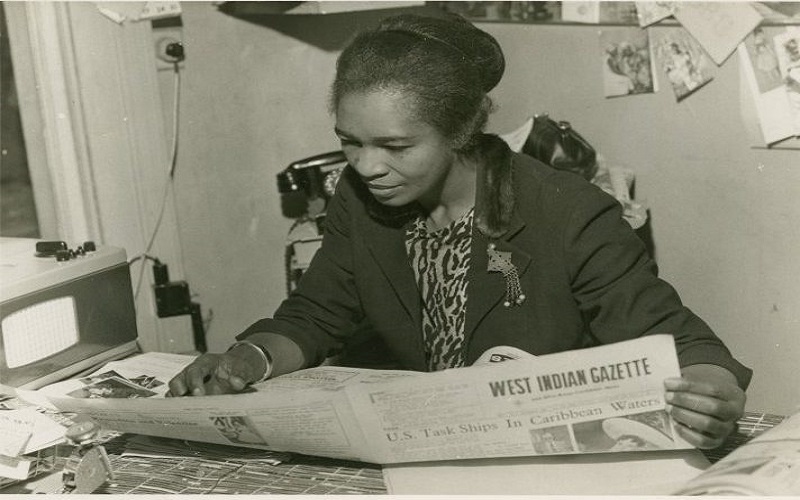 Claudia Jones, A Black History Month hero, reading a newspaper