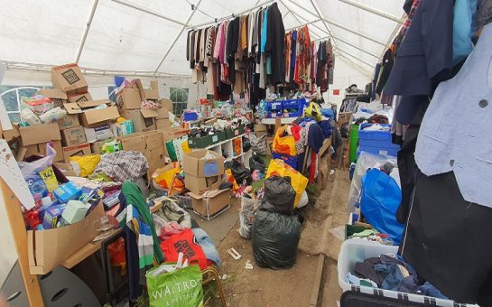 Large tent full of donations outside ACAA headquarters