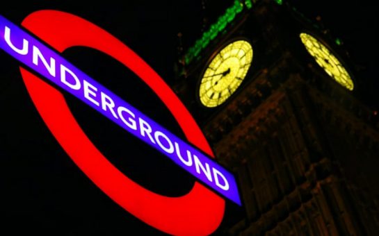 Photo of a London Underground sign and Big Ben at night