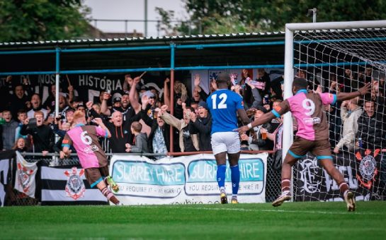 Alfie Bendle celebrates in front of Corinthian-Casuals' fans