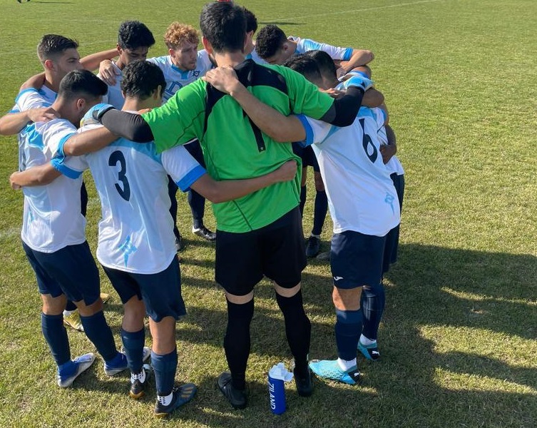 FC Deportivo huddling before a match