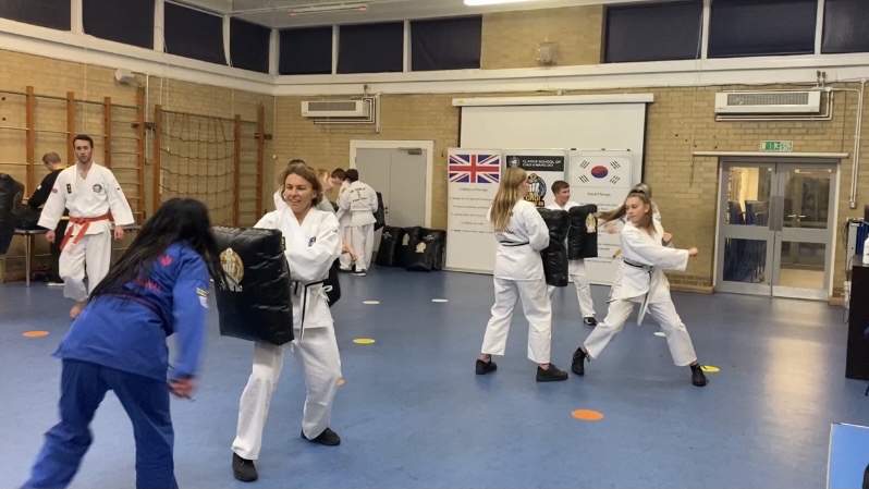 Women performing self-defence drills