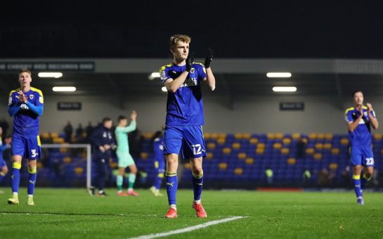 AFC Wimbledon fans applaud supporters