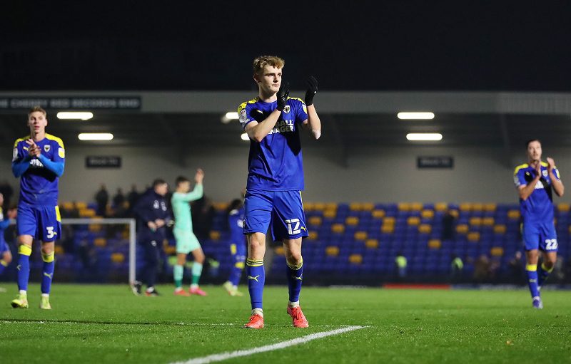 AFC Wimbledon fans applaud supporters