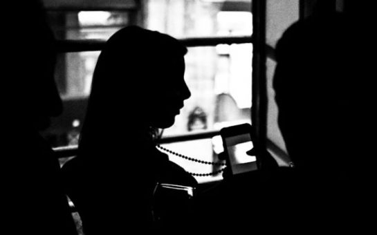 black and white picture of woman sitting down