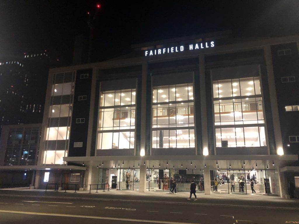 THE OUTSIDE OF FAIRFIELD HALLS AT NIGHT