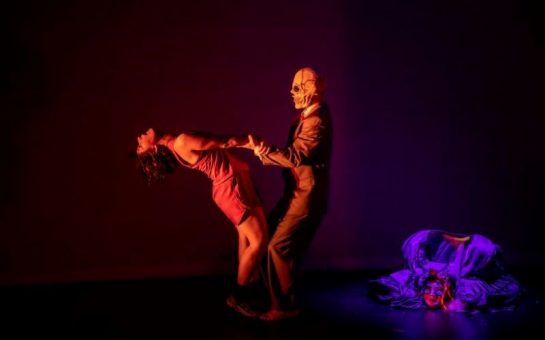 Jennifer Jackson dancing with man in skull mask