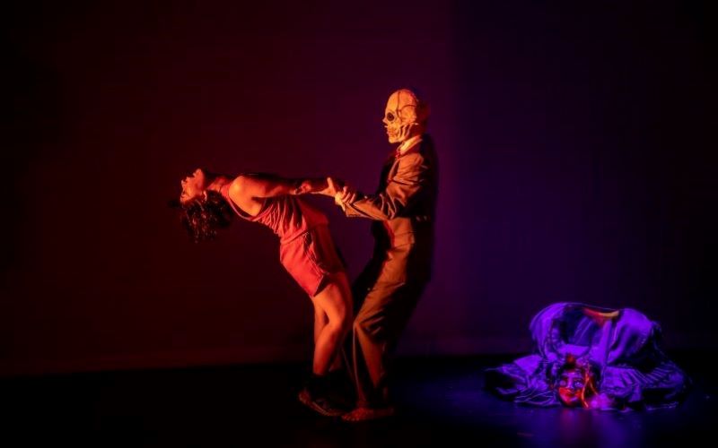 Jennifer Jackson dancing with man in skull mask