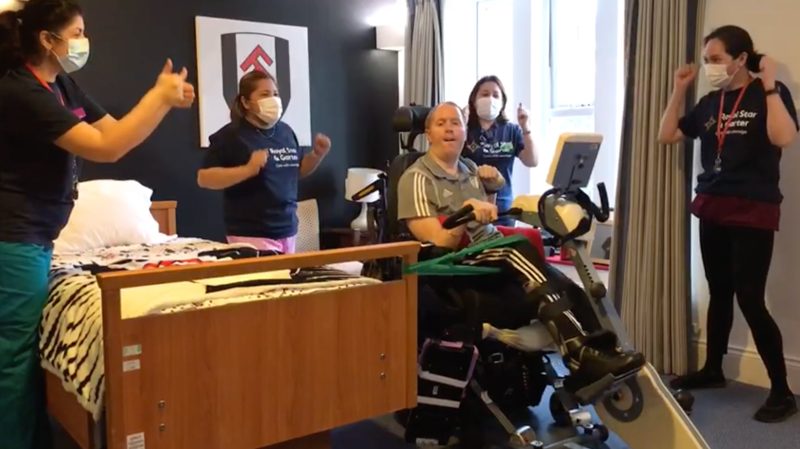 Stephen cheered on by Royal Star & Garter staff as he finished the 60-mile challenge in February, photo by Royal Star & Garter