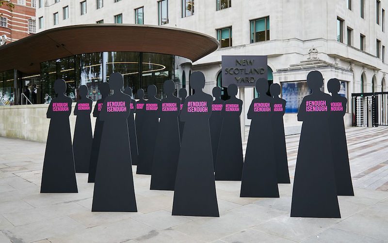 Silhouettes representing women outside New Scotland Yard