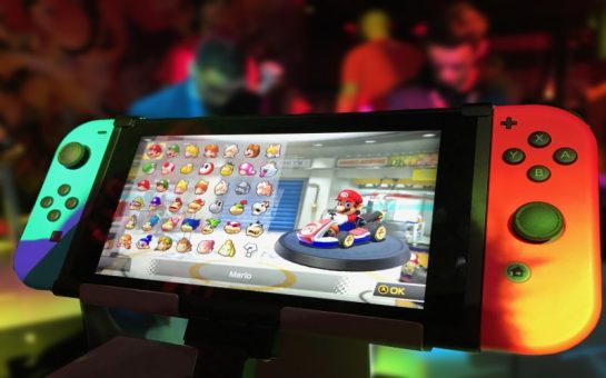A Nintendo Switch displaying Mario Kart 8 Deluxe on its screen