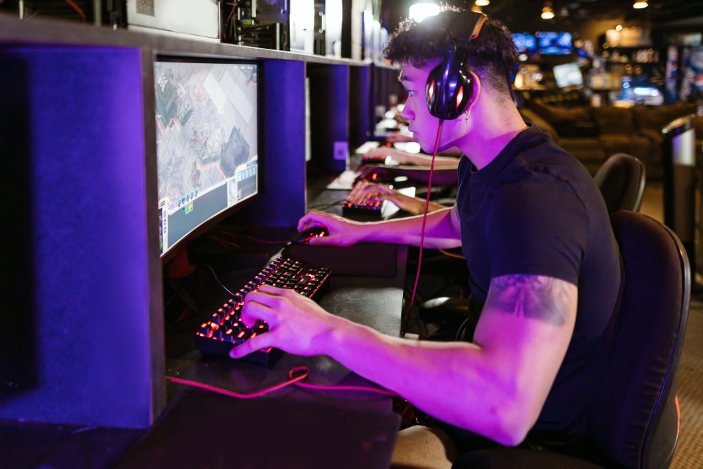 Man witha  gaming headset playing video games