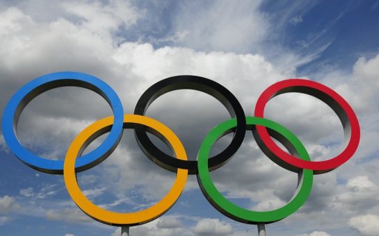 The five Olympic rings anterior to a cloudy sky