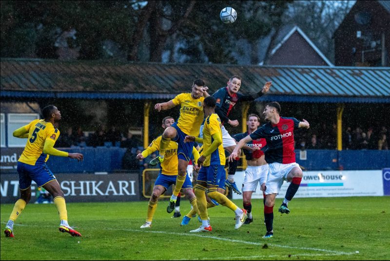 Hampton and Richmond Players Compete for the ball