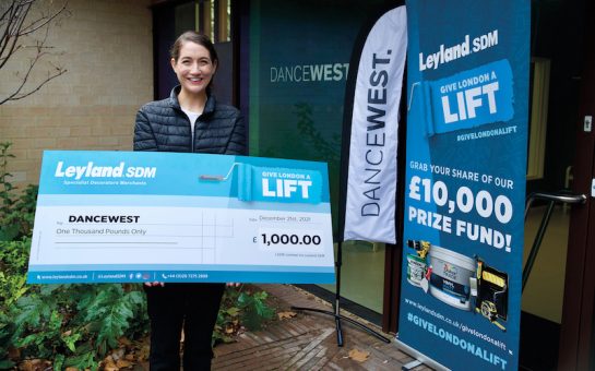 dance west holding the £1000 cheque