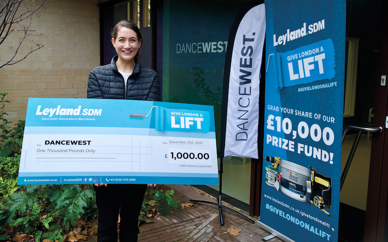 dance west holding the £1000 cheque