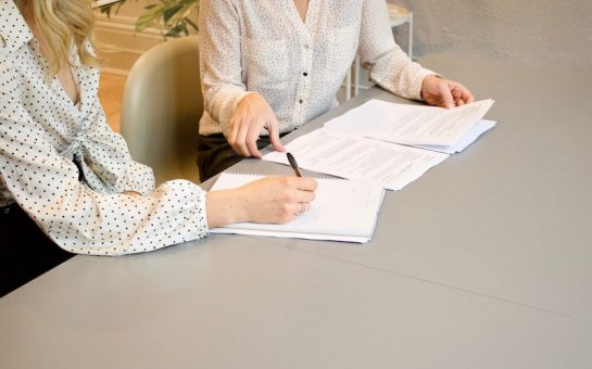 women sorting out documents