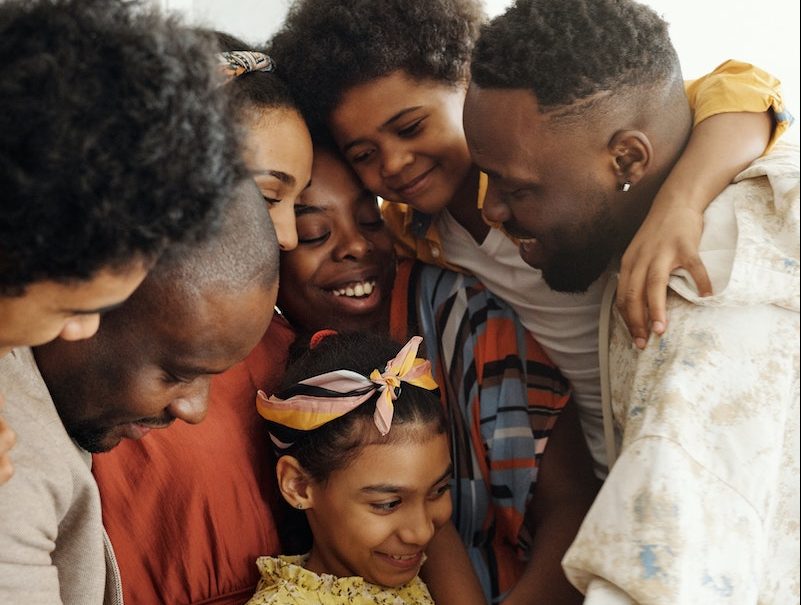 Black family hugging