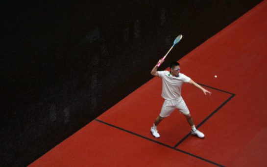 man playing rackets