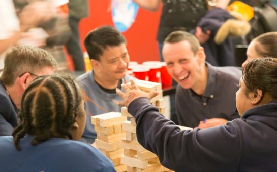 happily members playing jenga