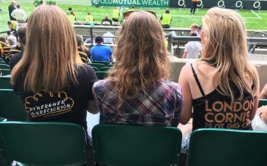women watching rugby game