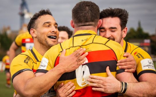 players embracing on the pitch
