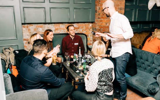 people at smudged lipstick enjoying drinks at a table
