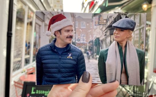 Jason Sudeikis and Hannah Wadham as their characters on Ted Lasso walk down a street.